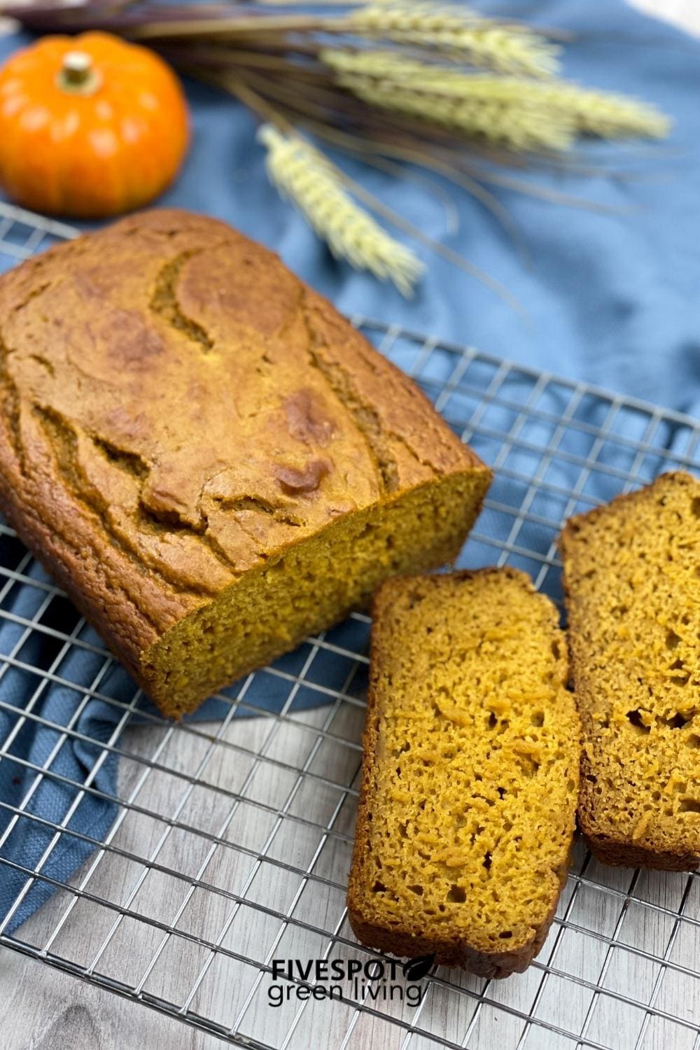 applesauce pumpkin spice bread with straw and pumpkins
