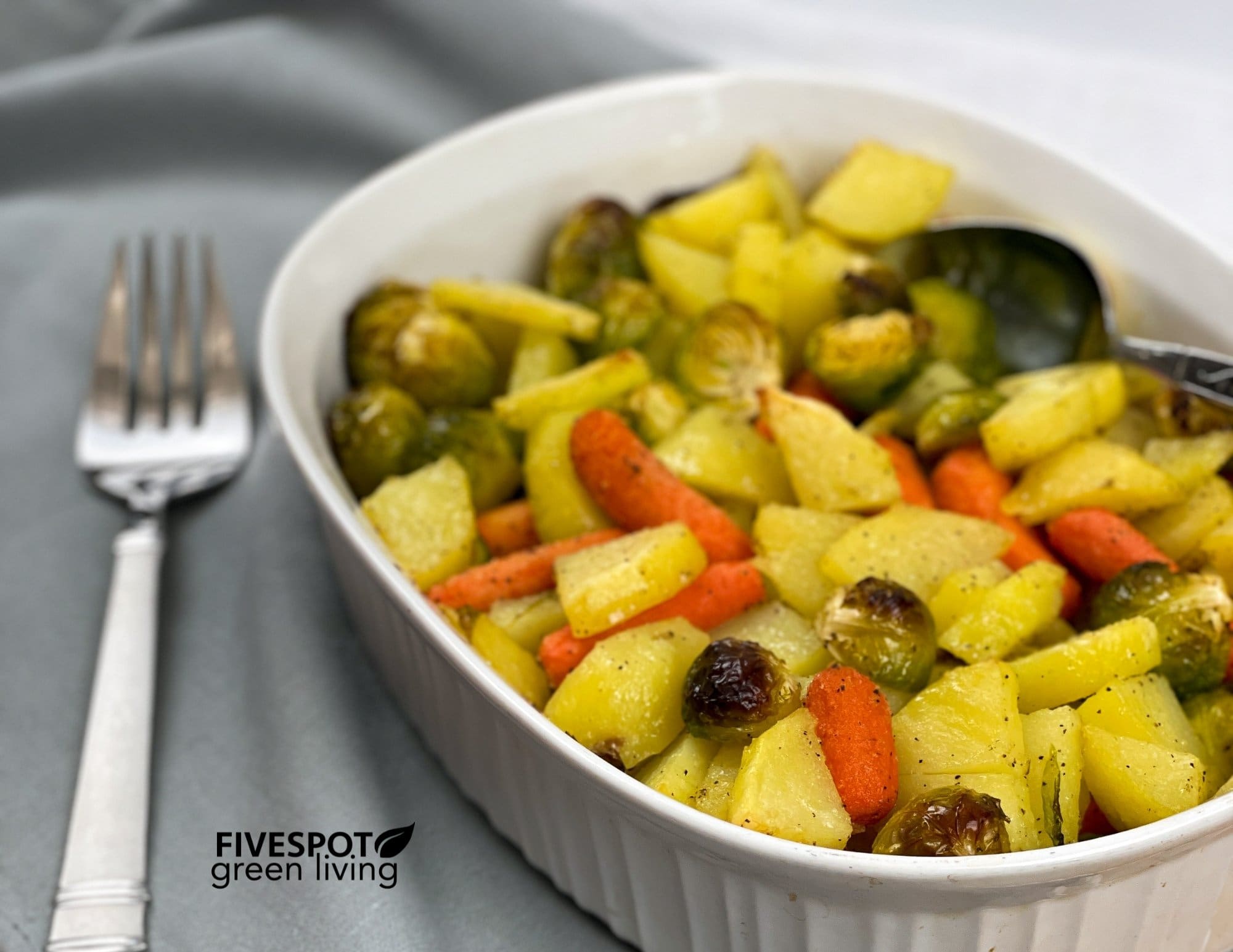 potato vegetable casserole on towel with fork