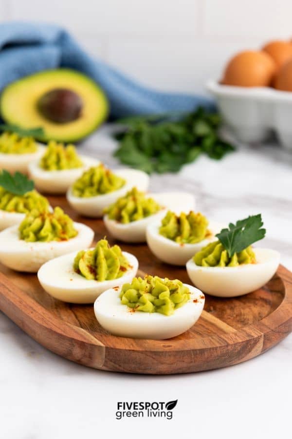 avocado deviled eggs appetizer on board